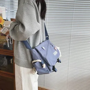 Casual Japanese Harajuku style canvas crossbody messenger bag for students, large capacity.