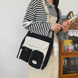 Korean style canvas messenger bag with contrast color design, cute pins and bear pendant.