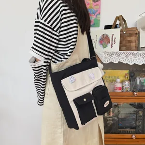 Canvas crossbody bag for women, retro casual messenger bag with multiple pockets and cute pins.