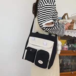 Korean style canvas crossbody bag for women, casual vintage student messenger bag with cute pins.