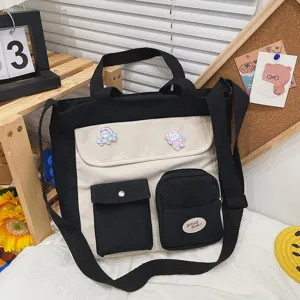 Canvas messenger bag detail showing cute contrast color design with multi-pockets and badges.