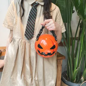 Halloween pumpkin round crossbody bag with black acrylic chain handle and cute devil face.