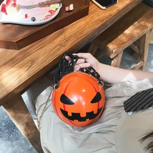 Halloween pumpkin novelty handbag with chunky black chain, stylish acrylic orange devil bag.