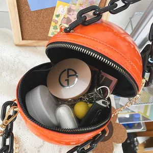 Glossy orange ball crossbody bag detail, trendy acrylic chain, unique fashion novelty purse