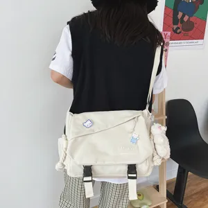 Casual Japanese style canvas messenger bag with large capacity, perfect for daily student use.