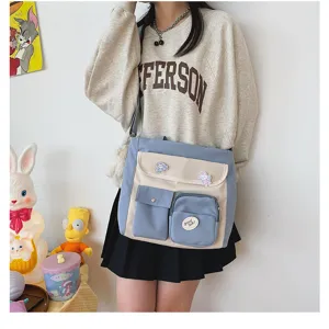 Detail view of canvas crossbody bag with multi pockets and cute design for casual daily use.