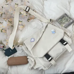 Detail view of Japanese casual canvas crossbody bag, featuring double buckles and spacious storage.