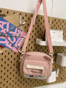 Süße rosa Umhängetasche mit Bärenohren Design, klarem Frontfach und verstellbarem Gurt für Alltag.
