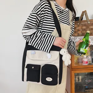 Korean style canvas cross-body bag for women, retro multi-pocket shoulder bag casual.