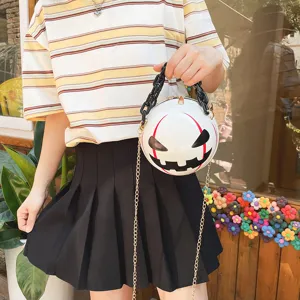 Halloween pumpkin devil round crossbody bag with black acrylic chain and stylish design.