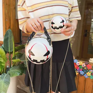Halloween pumpkin devil round crossbody bag with chunky acrylic chain and gold strap stylish.