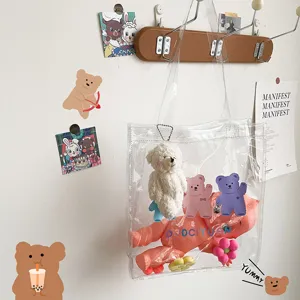 Transparente Umhängetasche für Damen mit süßem Plüschbären Anhänger im süßen Cartoon Design.