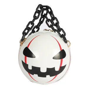 Close-up detail shot of the Halloween pumpkin demon round handbag with acrylic chain.