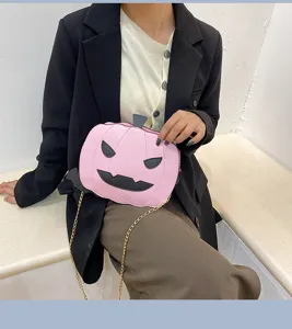 Cute pink pumpkin shaped crossbody bag for women, perfect Halloween PU leather shoulder bag.