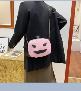 Detail view of fashion Halloween pumpkin PU leather crossbody bag with chain strap.
