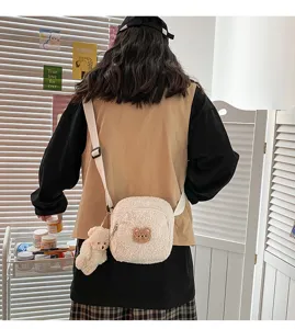 Cute fluffy lamb wool crossbody bag featuring an adorable small bear plush pendant and patch.
