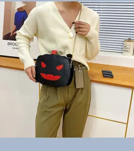 Halloween pumpkin PU leather crossbody bag, black spooky shoulder bag with chain strap.