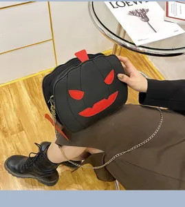 Halloween pumpkin PU leather crossbody bag with chain strap, trendy funny fashion style.
