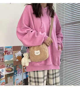 Cute fluffy teddy bear crossbody bag for women, cozy winter plush shoulder bag design.