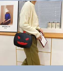 Halloween pumpkin crossbody bag for women, cute PU leather shoulder bag with chain strap.
