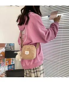 Cute fluffy lamb wool crossbody bag with adorable bear patch and pendant for sweet girls.