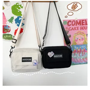 Bolso cruzado de lona estilo Harajuku para estudiantes, bolso de hombro casual con bolsillos.