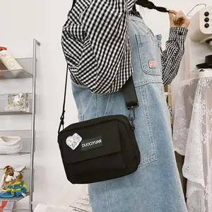 Bolso cruzado de lona negra de estilo Harajuku japonés para mujer bolso de estudiante.