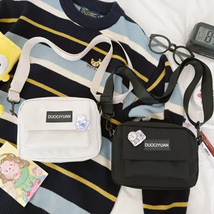 Bolso cruzado de lona informal Harajuku japonés detalle con dos colores y bolsillos