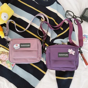 Bolso cruzado de lona con parches bonitos, bolsos pequeños rosa y morado para uso diario.