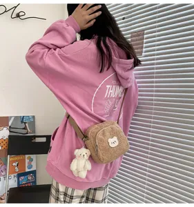 Cute lamb wool crossbody bag for women, soft plush small shoulder bag with lovely bear pendant.