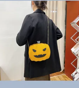 Halloween pumpkin PU leather crossbody bag with chain strap, fun spooky shoulder bag for women.