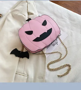 Cute pink pumpkin crossbody bag with bat pendant, novelty Halloween PU leather shoulder bag.