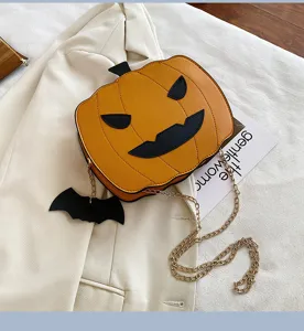 Halloween pumpkin crossbody bag with metal chain and bat pendant, stylish PU leather material.