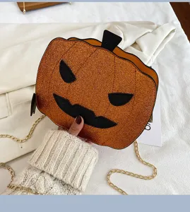 Detail view of the Halloween glitter orange pumpkin crossbody bag with gold chain strap.