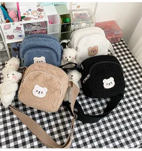 Cute sherpa crossbody bag detail, fluffy fleece bear purse closeup, sweet girl style design.