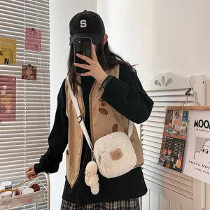 Cute white sherpa crossbody bag for women, fluffy lamb wool shoulder bag with bear pendant.
