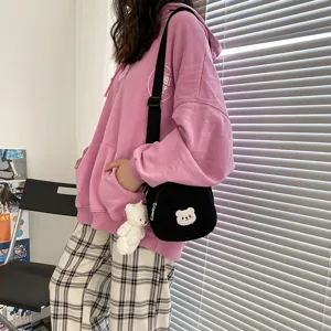 Cute fuzzy lamb wool cross body bag with bear pendant and embroidery for daily wear.