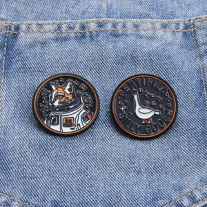Cute funny cat astronaut and silly goose enamel pins badge details and design close-up.