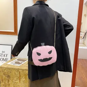 Pink Halloween pumpkin crossbody bag for women, cute PU leather shoulder bag with chain strap.