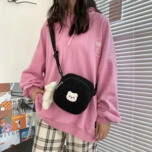 Cute bear sherpa crossbody bag for women, stylish soft fleece shoulder bag with plush pendant.