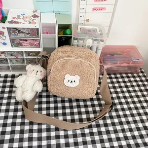 Cute fluffy lamb wool crossbody bag with a sweet bear pendant, perfect for daily casual style.