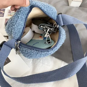 Detail view of the cute lamb wool crossbody bag showing interior capacity and soft texture.