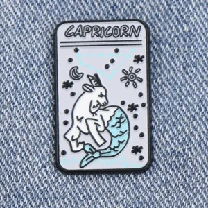 Capricorn zodiac sign enamel lapel pin, tarot card style astrology metal badge accessory.