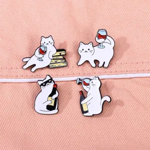 Cute white cat red wine alloy brooch detail shot, perfect for clothing and bag decoration.