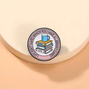 Detailed close-up of a creative literature book enamel pin badge metal brooch for backpack clothes.