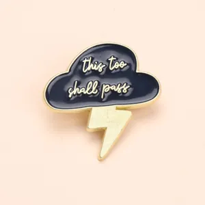 Enamel pin featuring a dark blue cloud and lightning bolt with inspirational quote for bags.