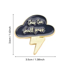 Black and gold lightning cloud enamel pin badge with inspirational quote, cute fashion accessory.