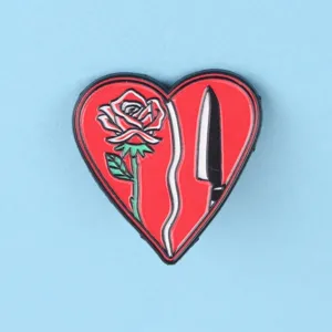 Dark romantic heart brooch featuring a red rose and dagger enamel pin exquisite detail.