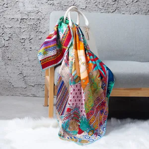 Luxurious orange silk square scarf featuring vibrant jungle and geometric prints for women.