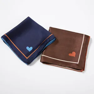 Detail view of women satin square scarf 70cm with heart print and elegant border design.